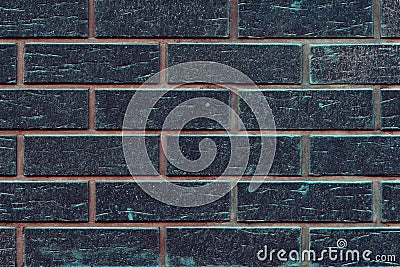 Black beautiful new toned brick wall texture background. Dark bricks with orange and green stucco Stock Photo