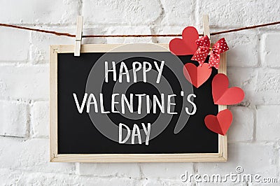 Text Happy Valentine`s Day written on a blackboard Stock Photo