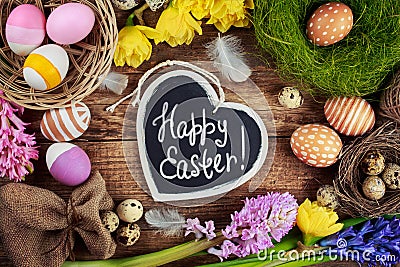 Black board with text - Happy Easter. Colorful Stock Photo