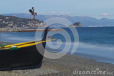 Black Boat on the Beach Stock Photo