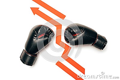 Black boxing gloves separated with arrow sign and ready to fight Stock Photo