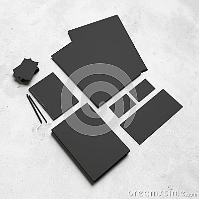 Black branding elements on white concrete background Stock Photo