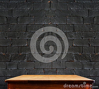 Black brick wall and wooden table,perspective background Stock Photo