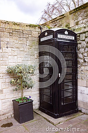 Black British phonebox London in UK, England Stock Photo