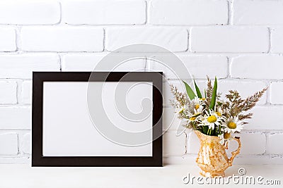 Black brown landscape frame mockup with chamomile and grass in Stock Photo