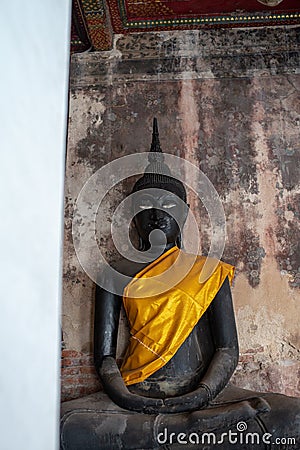 Black Buddha statue in Wat Suthat Thepphawararam the royal temple of the first grade in Bangkok. Stock Photo