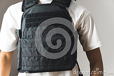 Black bullet proof vest on man body. No face Stock Photo