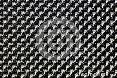 Black bumpy rubber surface used as a background. Black and white texture of rubber material with copy space. Bubble dots backgroun Stock Photo