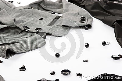 Black buttons with parts of clothes Stock Photo