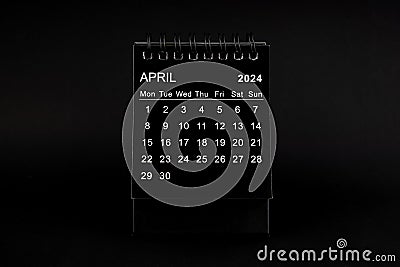 Black Calendar for April 2024. Desktop calendar on a black background Stock Photo