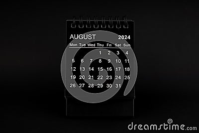 Black Calendar for August 2024. Desktop calendar on a black background Stock Photo