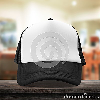 Black cap made from fabric material on dressing room background with mockup baseball caps style. White caps template place on Stock Photo