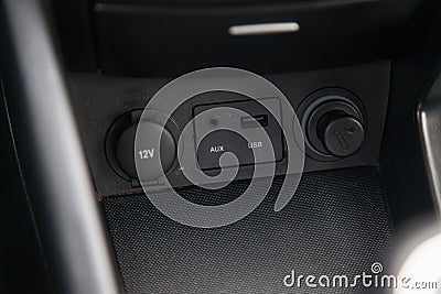 Car panel with aux, usb connectors, 12V socket and cork Stock Photo