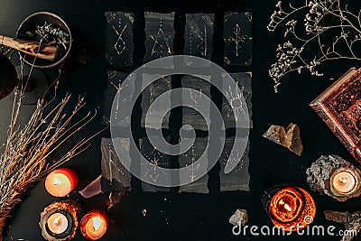 Black cards with magic signs laid out on a dark table. Halloween Stock Photo