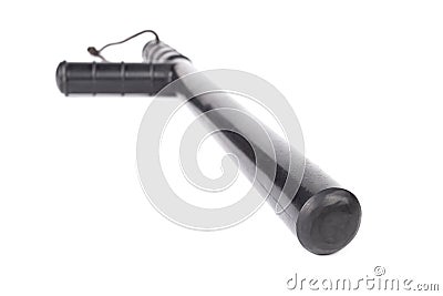 Black classic rubber police tonfa baton isolated on white background with selective focus and wide angle Stock Photo