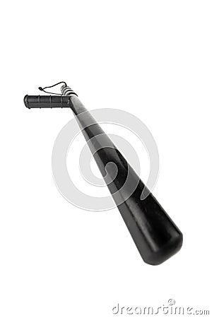Black classic rubber police tonfa baton isolated on white background with selective focus and wide angle Stock Photo