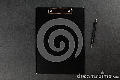 Black clipboard on a table Stock Photo