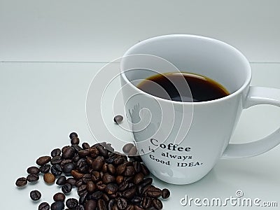 black coffee and coffee beans on white bacjground. Stock Photo