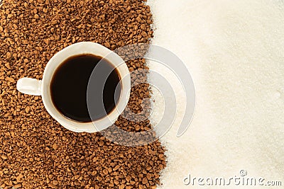 Black coffee in a Cup with entourage of ground coffee and sugar. The view from the top Stock Photo