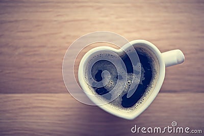 Black coffee, espresso in heart shaped cup. Love, Valentine's Day, vintage Stock Photo