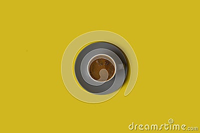 Black coffee isolated on yellow background Stock Photo