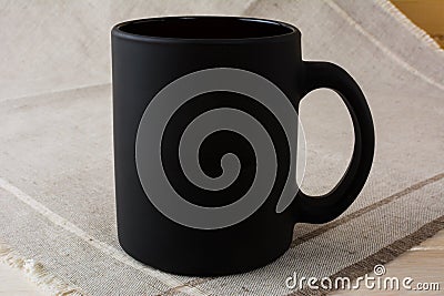 Black coffee mug mockup on the linen napkin Stock Photo