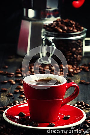 Black coffee in a red cup, black background, selective focus Stock Photo