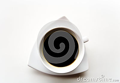 Black coffee in a white cup on a white saucer. Stock Photo