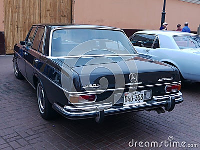 Black color Mercedes-Benz 280 S exhibited in Lima Editorial Stock Photo