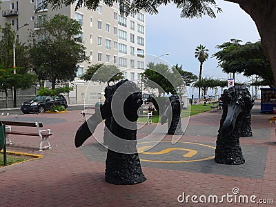 Black color statues in Barranco district of Lima Editorial Stock Photo