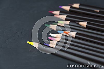 Black colorful pencils on black background.Dark version Stock Photo