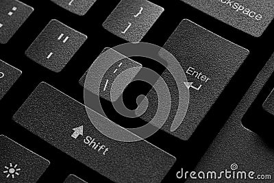 Black computer keyboard with a focus on the enter key. Confirmation, sending, claim button Stock Photo