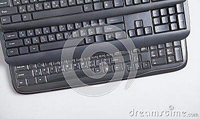 Black computer keyboards on grey background Stock Photo