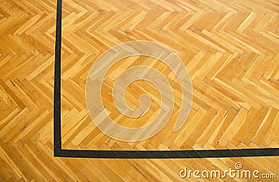 Black corner. Worn out wooden floor of sports hall with marking lines Stock Photo