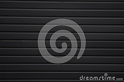Black Corrugated metal sheet texture surface of the wall. Galvanize steel background. Stock Photo
