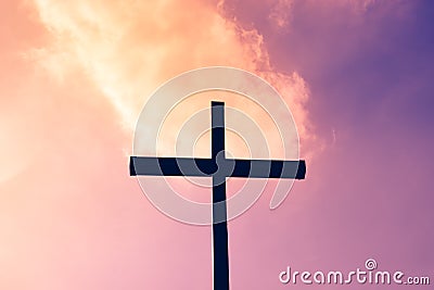 Black cross on a background of red and purple flaming sky, from Stock Photo