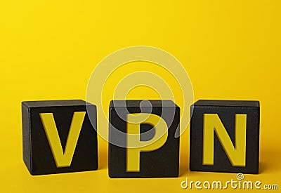 Black cubes with acronym VPN on yellow background, closeup view Stock Photo