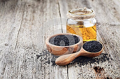 Black cumin oil with seeds Stock Photo