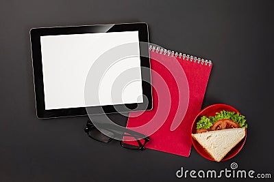 On a black desktop tablet pad notepad with a place for your inscription Stock Photo