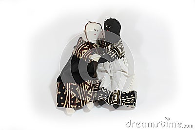 Black doll and white doll embrace concept forgiveness, reconciliation Stock Photo