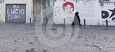 A black dressed woman walking Editorial Stock Photo