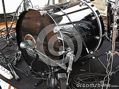 Black drum kit, cables and microphones closeup Stock Photo