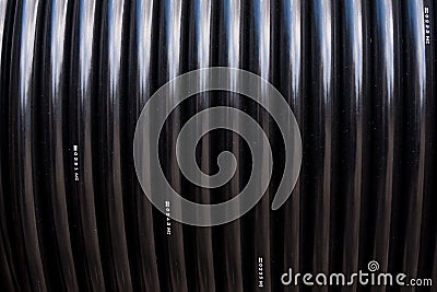 Black electric cable in reel Stock Photo