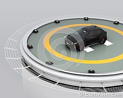 Black electric SUV parking on the helipad on building Stock Photo