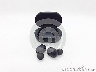 Black Electronic Modern Elegant Wireless Ear Pieces for Listening Music and Phone Tools in White Isolated Background Stock Photo