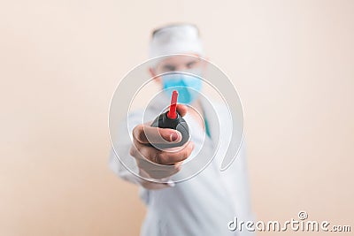 Black enema in defocused doctors hand Stock Photo