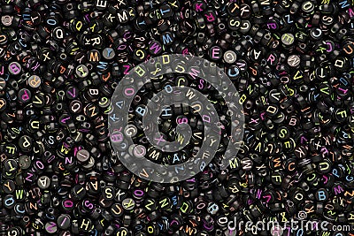 Black English letter beads background Stock Photo