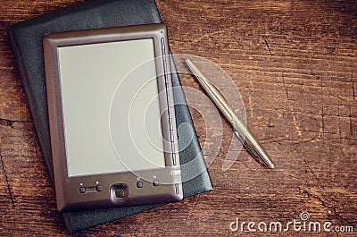 Black ereader with notebook and ink pen Stock Photo