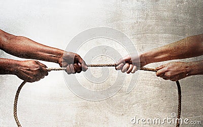 Black ethnicity arms with hands pulling rope against white Caucasian race person in stop racism and xenophobia concept Stock Photo