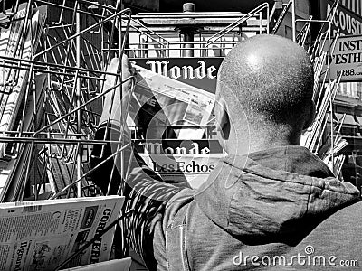 Black ethnicity man buys newspaper reporting handover ceremony p Editorial Stock Photo